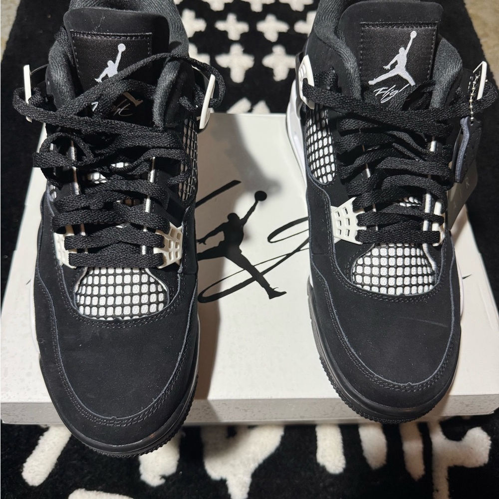Black and white Jordan 4’s